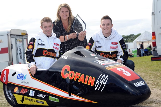 Becs Cubbon, of PokerStars, presents the Spirit of the TT Award to Isle of Man TT sidecar stars Tom and Ben Birchall (Stephen Davison/Pacemaker Press International)